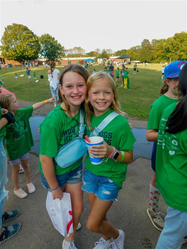 Students outside enjoying a family fun night for their school.